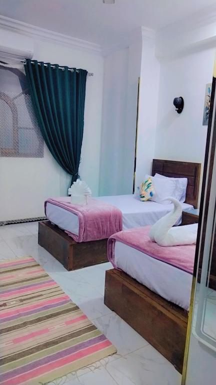 Postel nebo postele na pokoji v ubytování Sama Stars Hotel