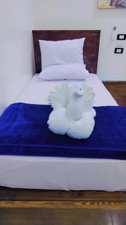 Postel nebo postele na pokoji v ubytování Sama Stars Hotel