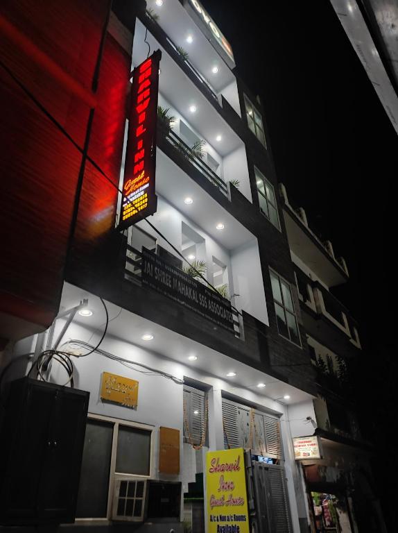 a building with a sign on the side of it at SHARVIL Inn in Lucknow