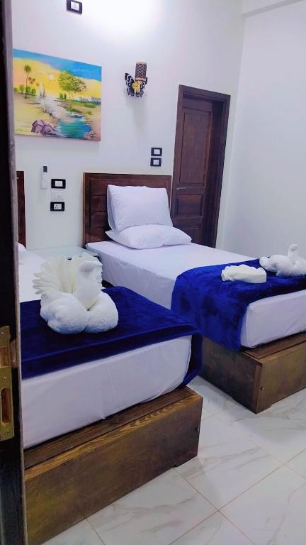 Postel nebo postele na pokoji v ubytování Sama Stars Hotel