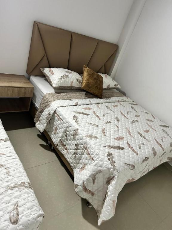 Postel nebo postele na pokoji v ubytování Hotel Lesus