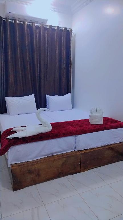 Postel nebo postele na pokoji v ubytování Sama Stars Hotel