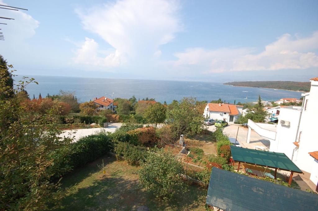 a view of the ocean from a house at Apartment Djuka in Njivice