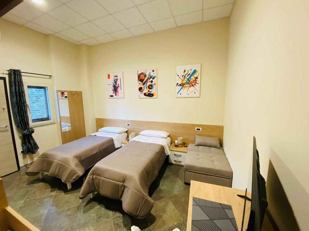 Postel nebo postele na pokoji v ubytování B&B l'angoletto