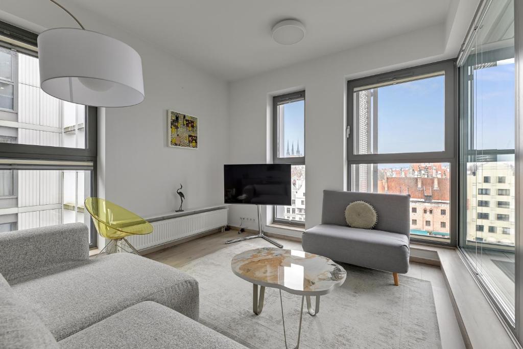 Televízia a/alebo spoločenská miestnosť v ubytovaní Granaria Comfort Apartments