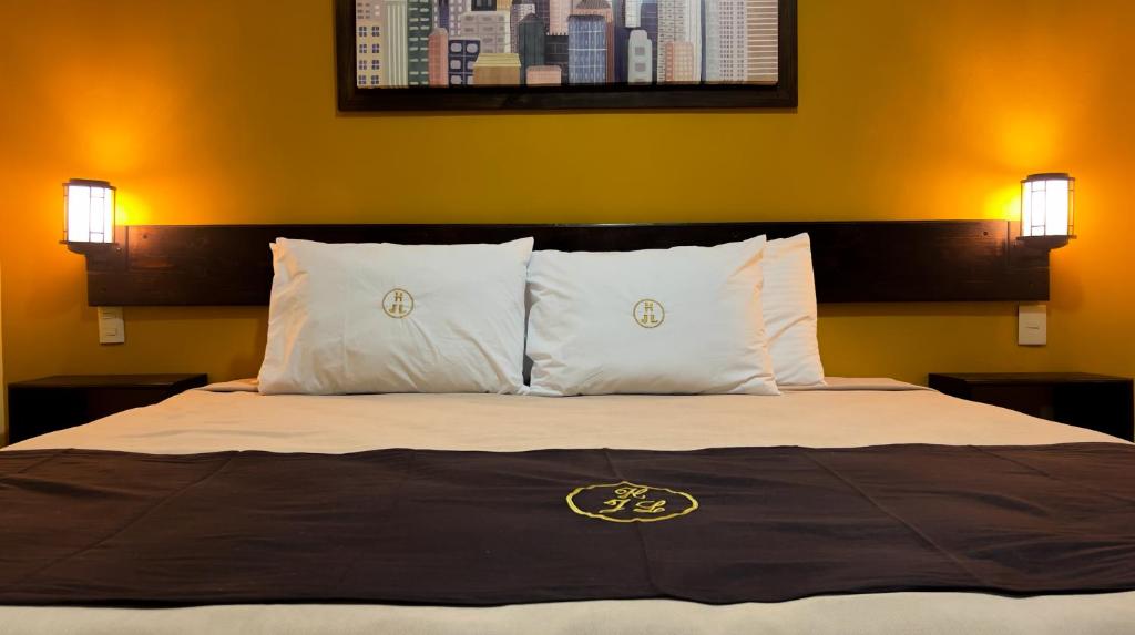 Postel nebo postele na pokoji v ubytování Hotel JL