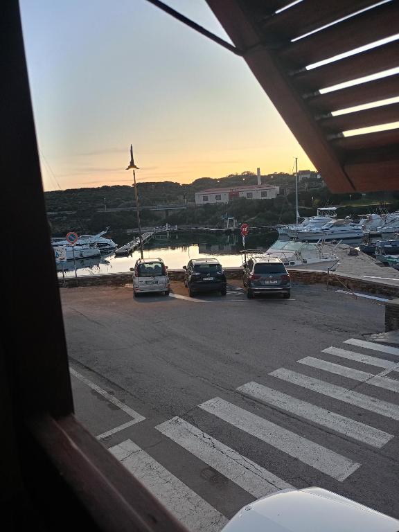 a group of cars parked in a parking lot at Casa dei bagnanti sul Porto Vecchio in Stintino