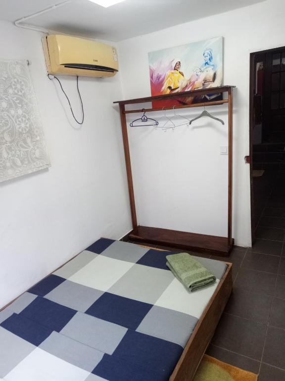 Postel nebo postele na pokoji v ubytování Casa Cacheu Homestay Guest House