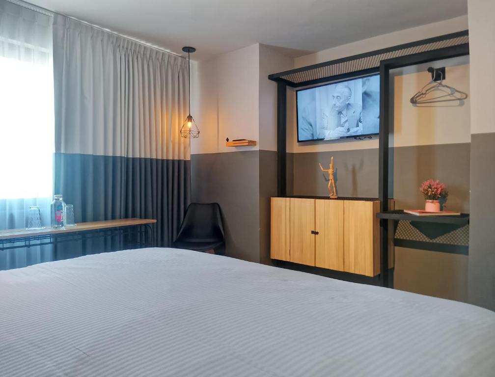 Ένα ή περισσότερα κρεβάτια σε δωμάτιο στο Hotel NEXT