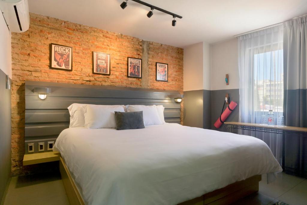 Ένα ή περισσότερα κρεβάτια σε δωμάτιο στο Hotel NEXT