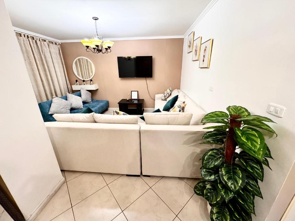 TV a/nebo společenská místnost v ubytování Apartamento en la mejor ubicación, centro de Loja