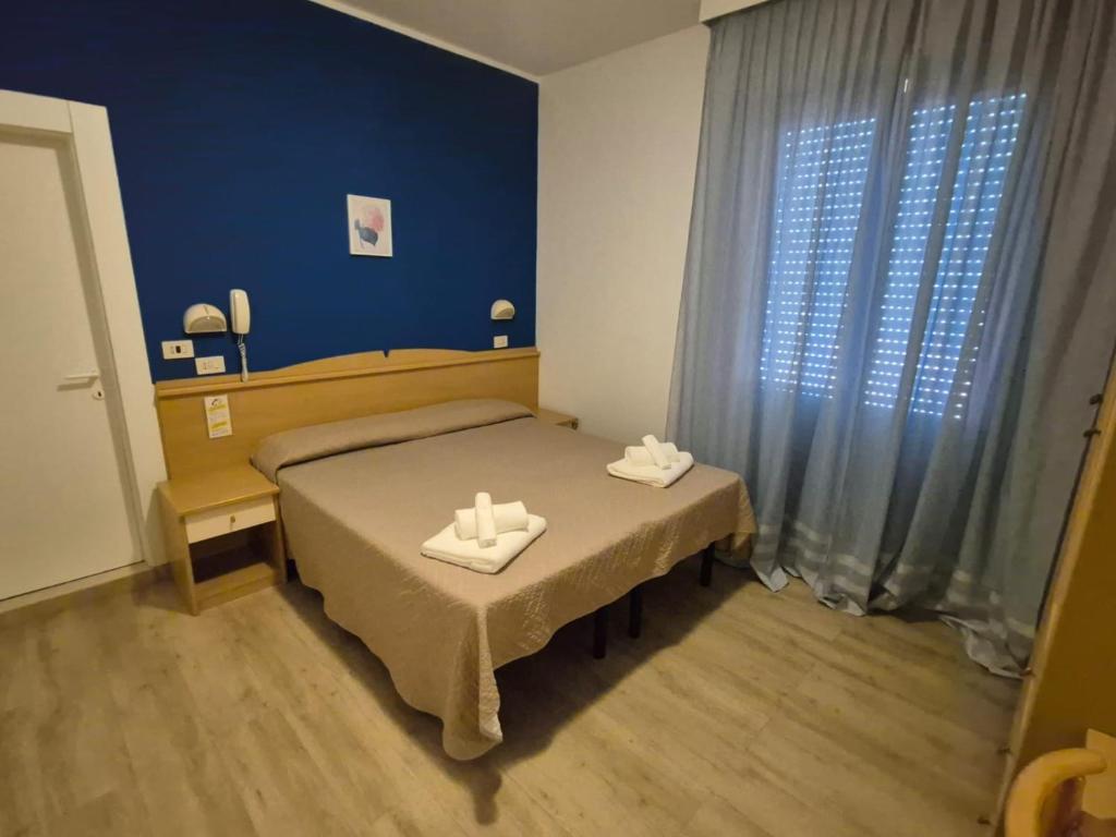 Postel nebo postele na pokoji v ubytování Hotel REX