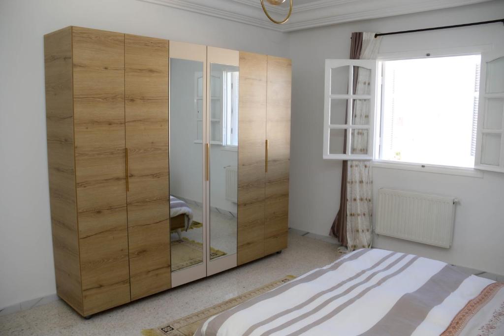 Postel nebo postele na pokoji v ubytování Appartement entier rénové à 5min de la Plage de Sousse