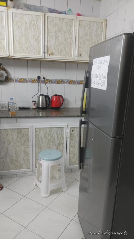 Kuchyň nebo kuchyňský kout v ubytování Muscat Galaxy Hostel