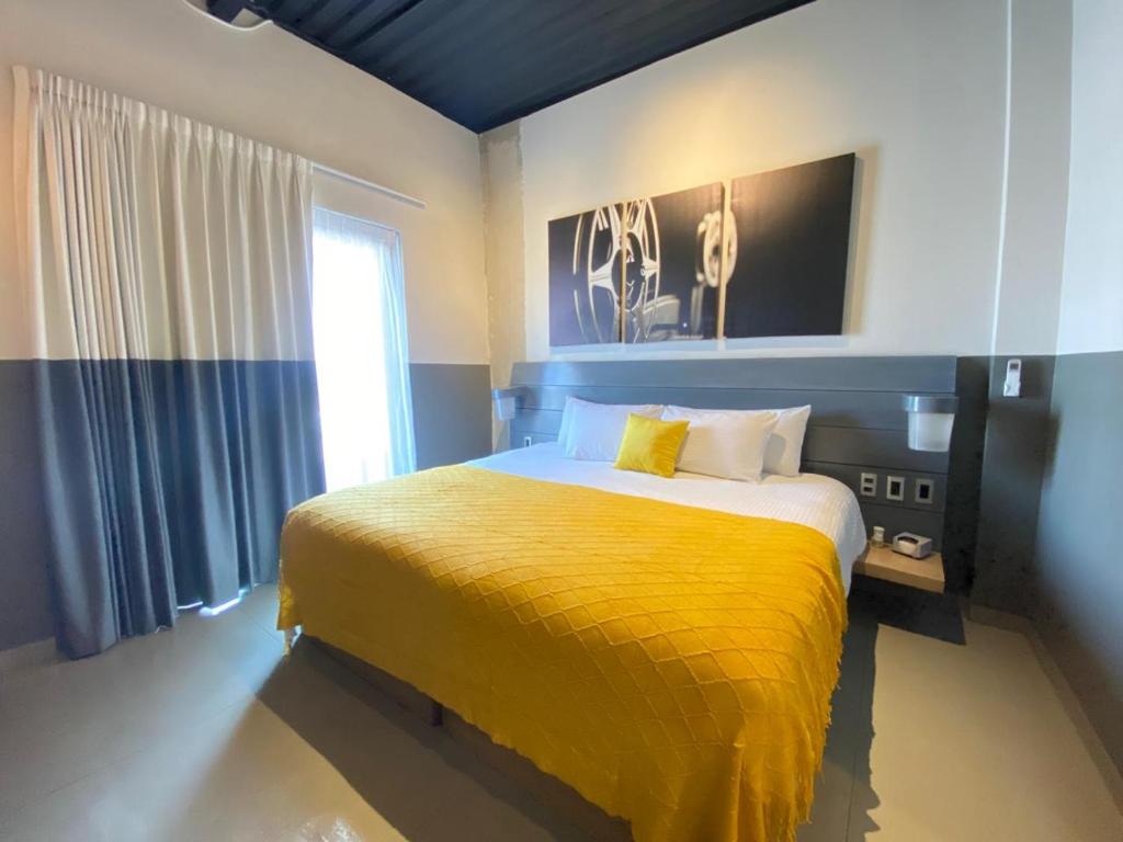 Ένα ή περισσότερα κρεβάτια σε δωμάτιο στο Hotel NEXT