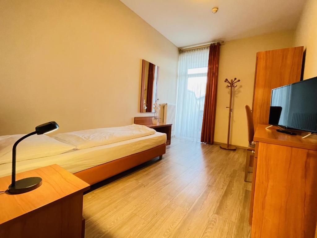 TV a/nebo společenská místnost v ubytování Albergo Cavallino s'Rössl