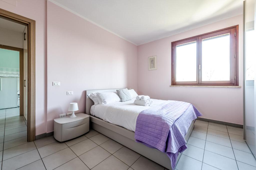 Postel nebo postele na pokoji v ubytování Hostly-Family Home Fosso Vecchio-Relax in Tuscany
