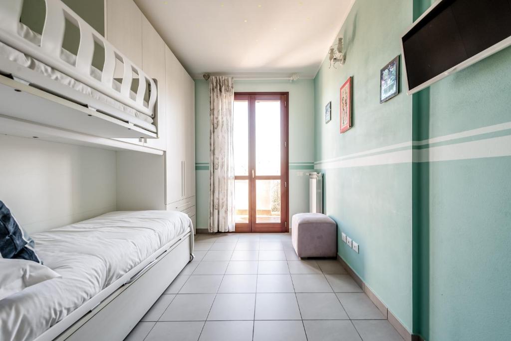 Postel nebo postele na pokoji v ubytování Hostly-Family Home Fosso Vecchio-Relax in Tuscany