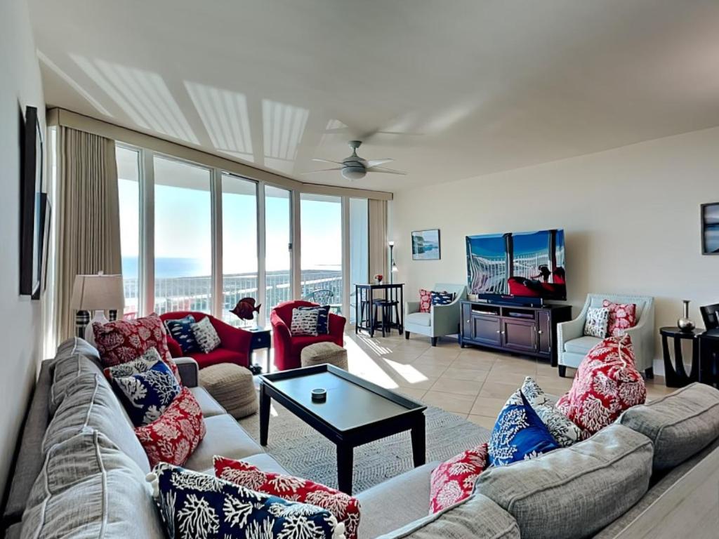 a living room with a couch and a table at Caribe The Resort #D1114 in Orange Beach