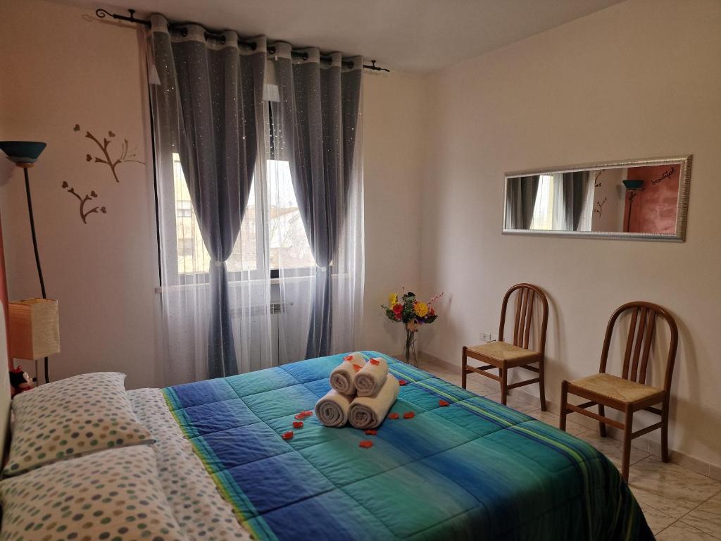 A bed or beds in a room at Appartamento Divino Tramonto