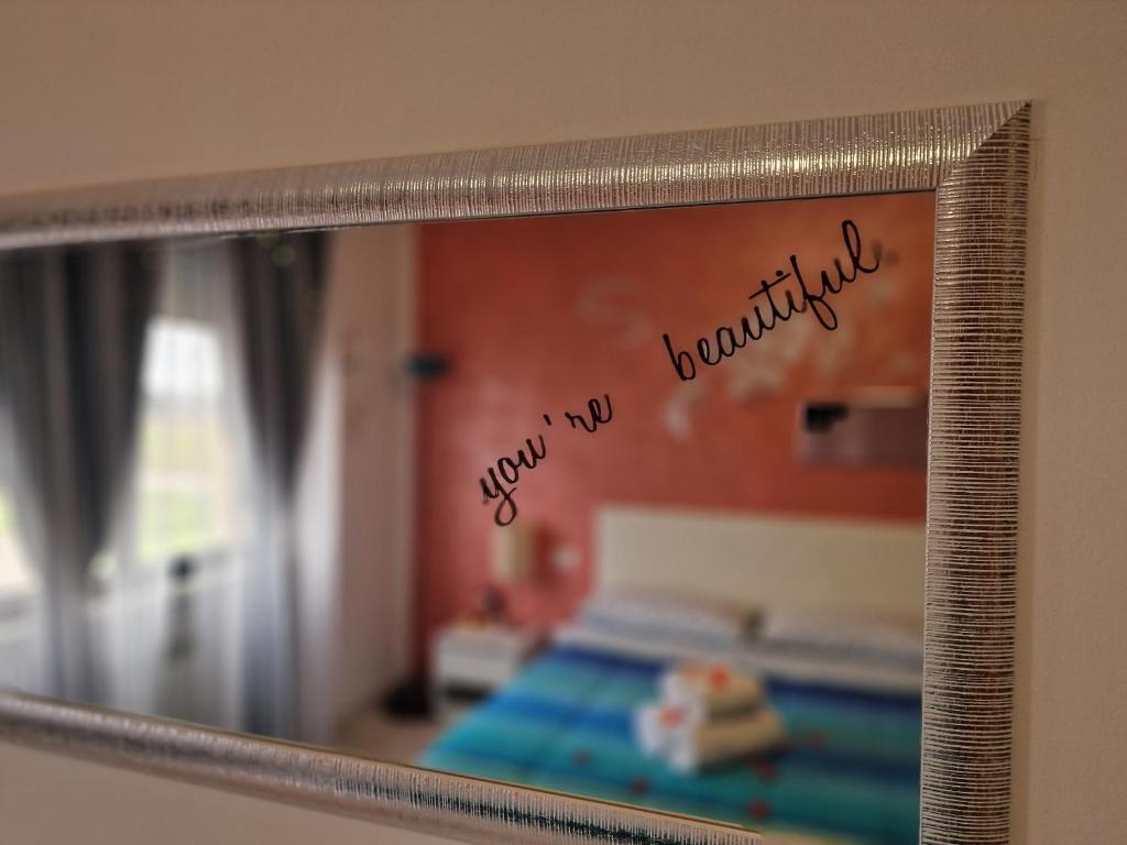 A bed or beds in a room at Appartamento Divino Tramonto