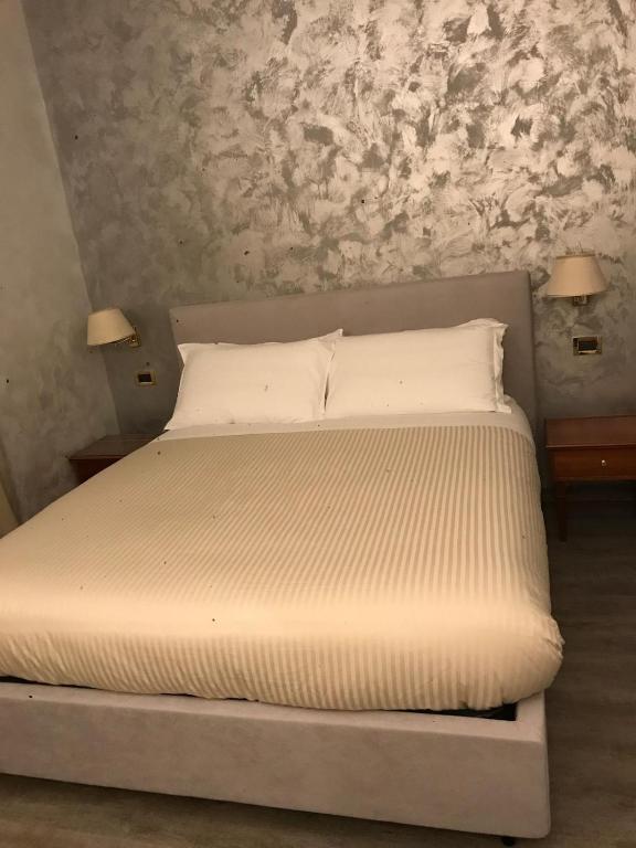 Postel nebo postele na pokoji v ubytování Sandel Giubileo Hotel