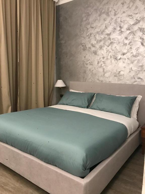 Postel nebo postele na pokoji v ubytování Sandel Giubileo Hotel