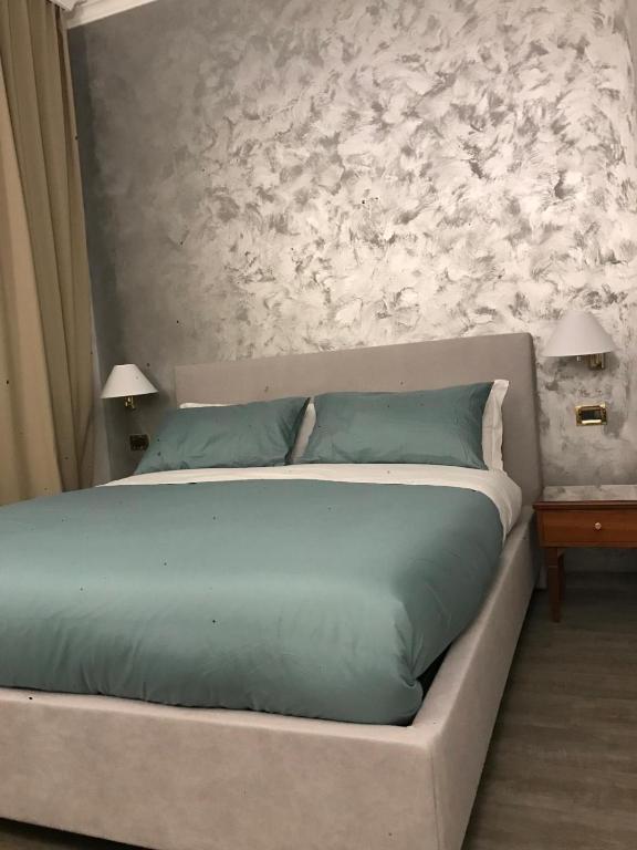 Postel nebo postele na pokoji v ubytování Sandel Giubileo Hotel