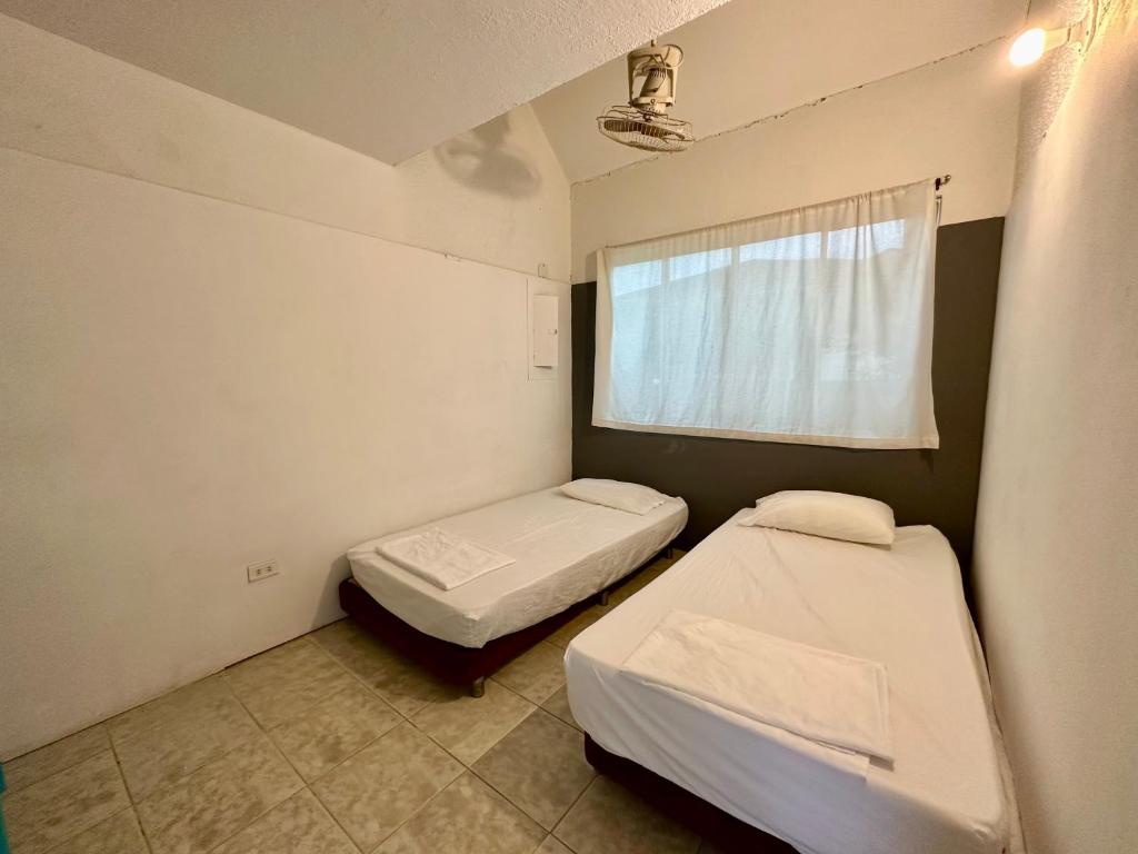 Postel nebo postele na pokoji v ubytování Casa en Girardot