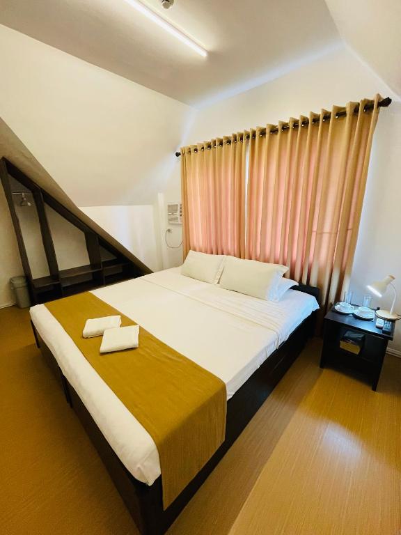 Postel nebo postele na pokoji v ubytování Castle Rock Boracay