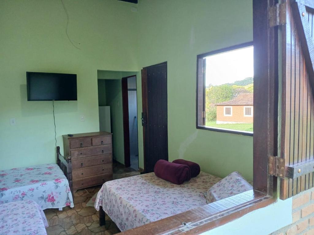 Postel nebo postele na pokoji v ubytování Chalé e Camping Elementais