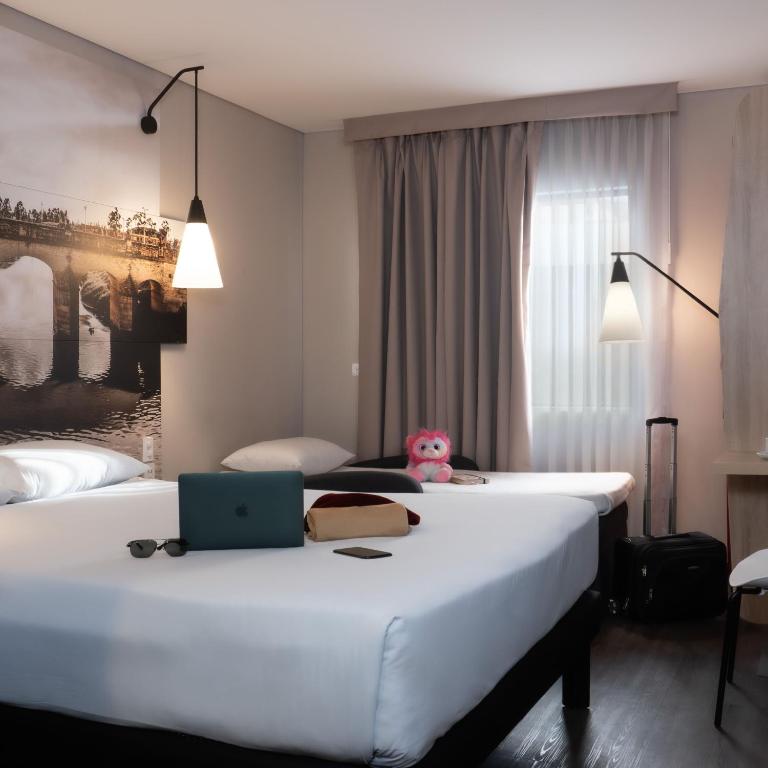 Postel nebo postele na pokoji v ubytování ibis Chia