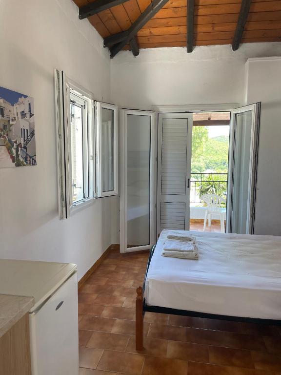 Postel nebo postele na pokoji v ubytování Villa Elpiniki