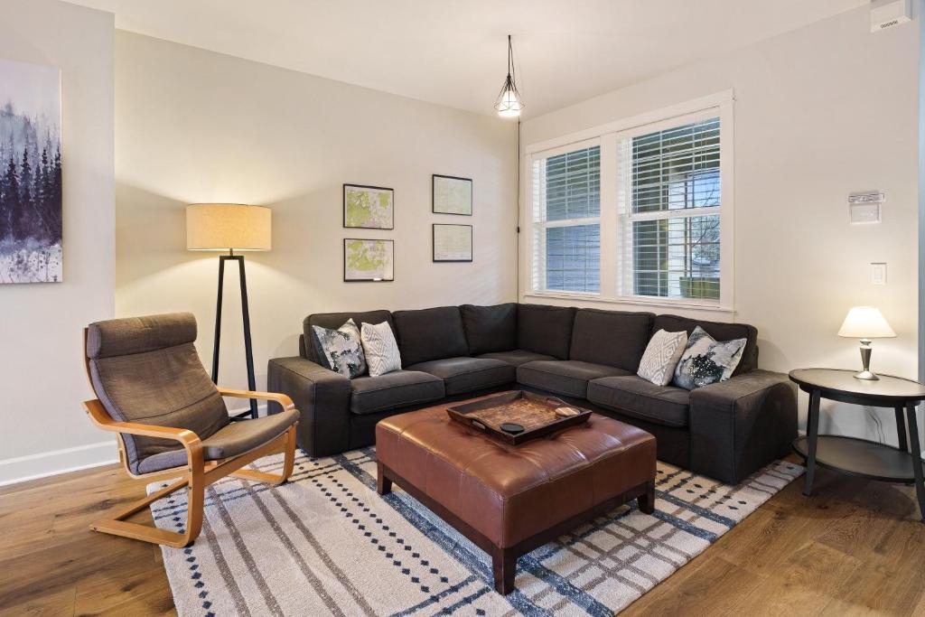 a living room with a couch and a chair at Tranquility on the Bluffs in Bend