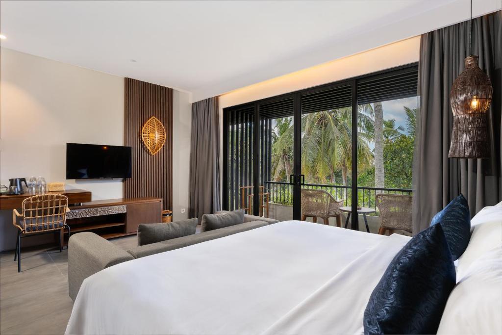 Postel nebo postele na pokoji v ubytování The Ning Resort Ubud