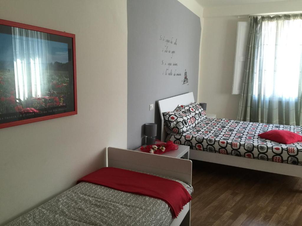 Posteľ alebo postele v izbe v ubytovaní L'Iris B&B