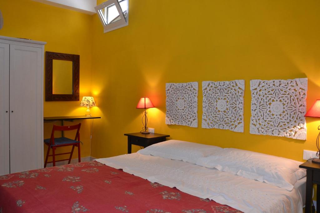 Postel nebo postele na pokoji v ubytování B&B Talìa