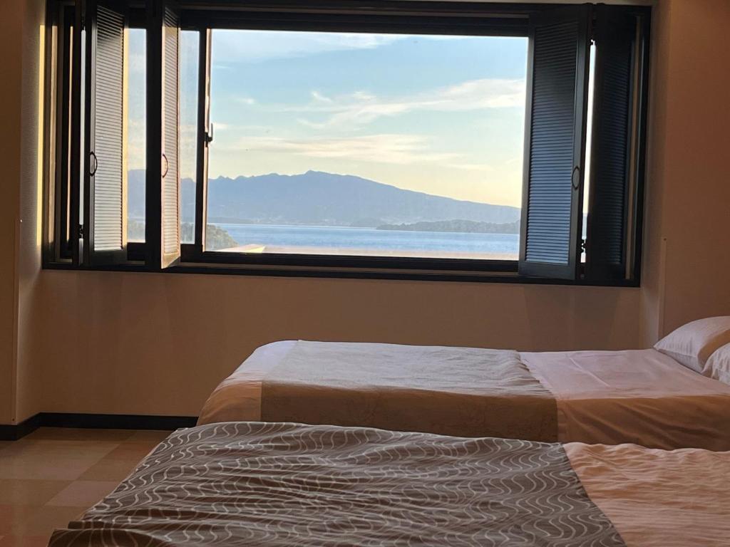 Postel nebo postele na pokoji v ubytování ホテル ラヴィアン HOTEL Lavien