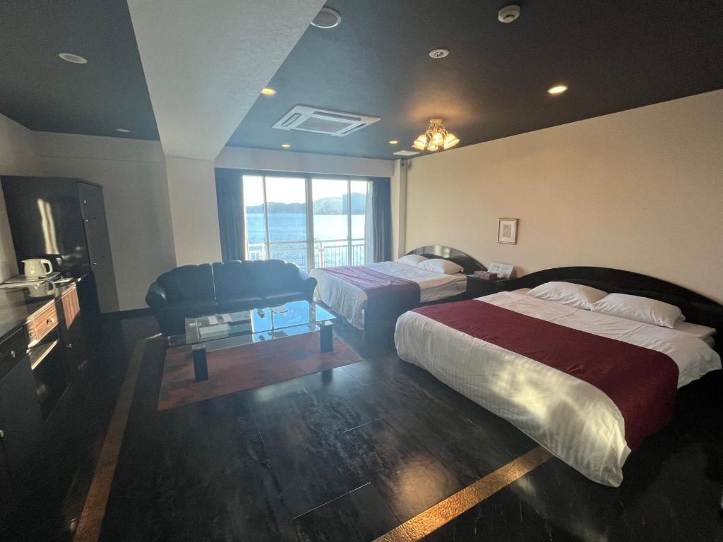 Postel nebo postele na pokoji v ubytování ホテル ラヴィアン HOTEL Lavien