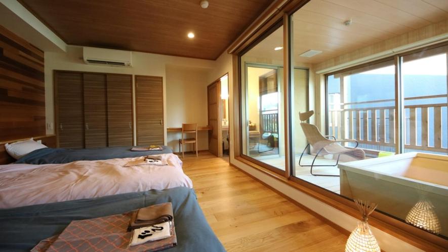 Postel nebo postele na pokoji v ubytování Kawaichiya Ryokan