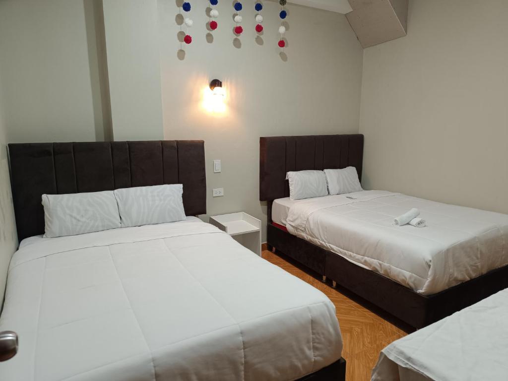 Postel nebo postele na pokoji v ubytování Hotel Chaska Illary Pisac