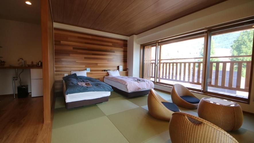 Postel nebo postele na pokoji v ubytování Kawaichiya Ryokan