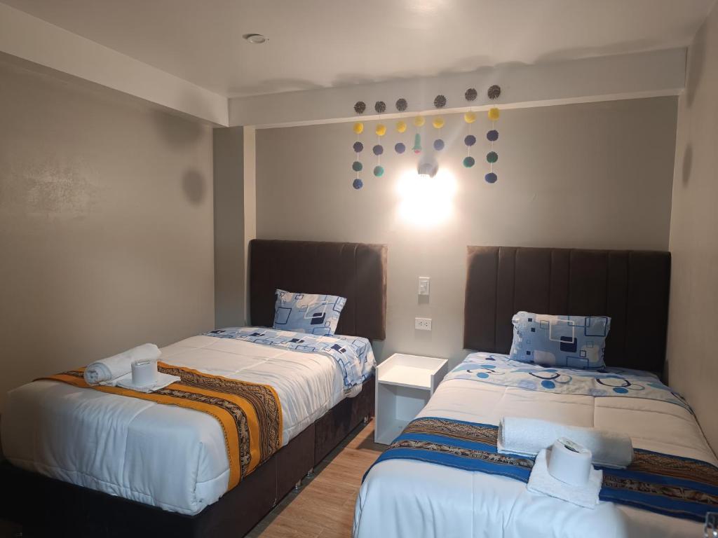 Postel nebo postele na pokoji v ubytování Hotel Chaska Illary Pisac
