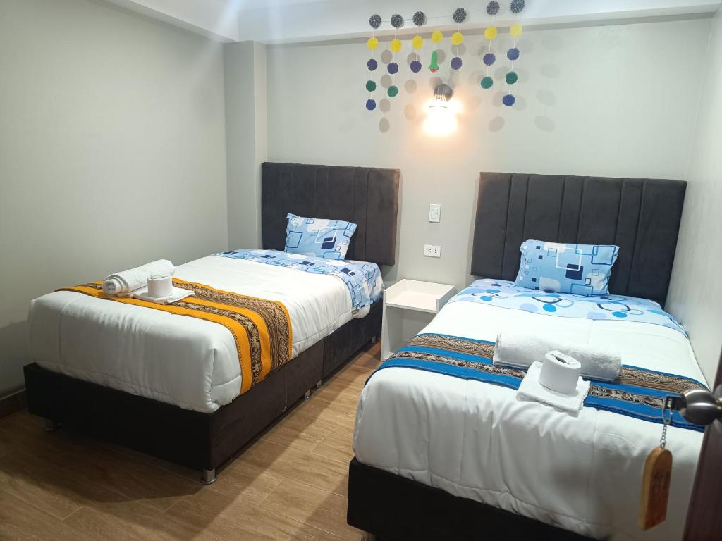Postel nebo postele na pokoji v ubytování Hotel Chaska Illary Pisac