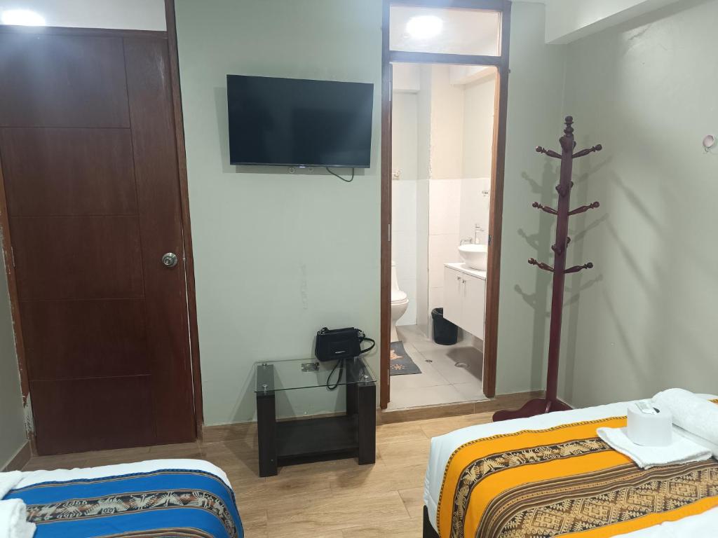 Postel nebo postele na pokoji v ubytování Hotel Chaska Illary Pisac