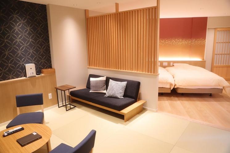Postel nebo postele na pokoji v ubytování Kawaichiya Ryokan