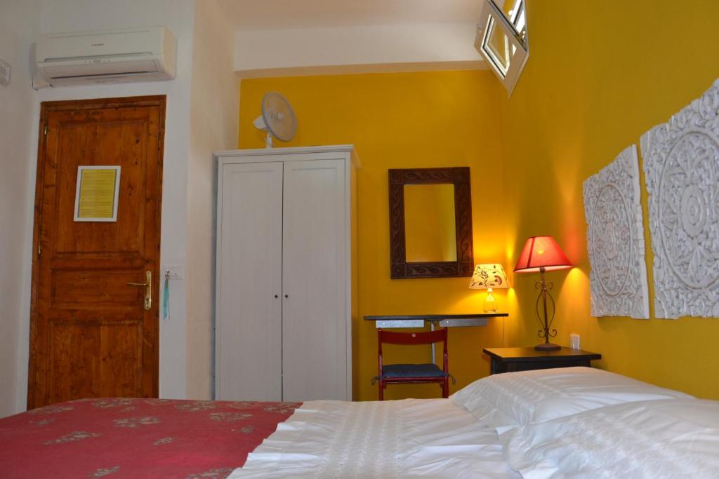 Postel nebo postele na pokoji v ubytování B&B Talìa