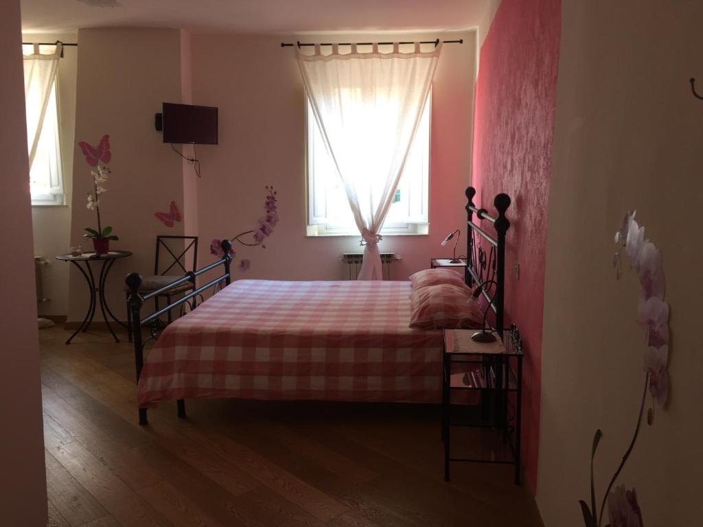 Posteľ alebo postele v izbe v ubytovaní L'Iris B&B