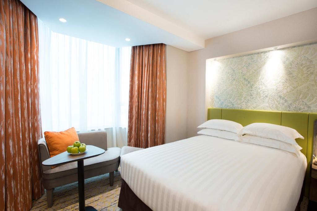 Katil atau katil-katil dalam bilik di Wharney Hotel