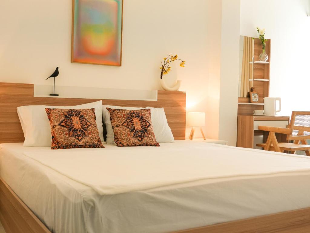 Postel nebo postele na pokoji v ubytování Place Hotel